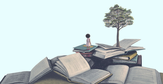 A mountain made of books. There is a tree at the top.